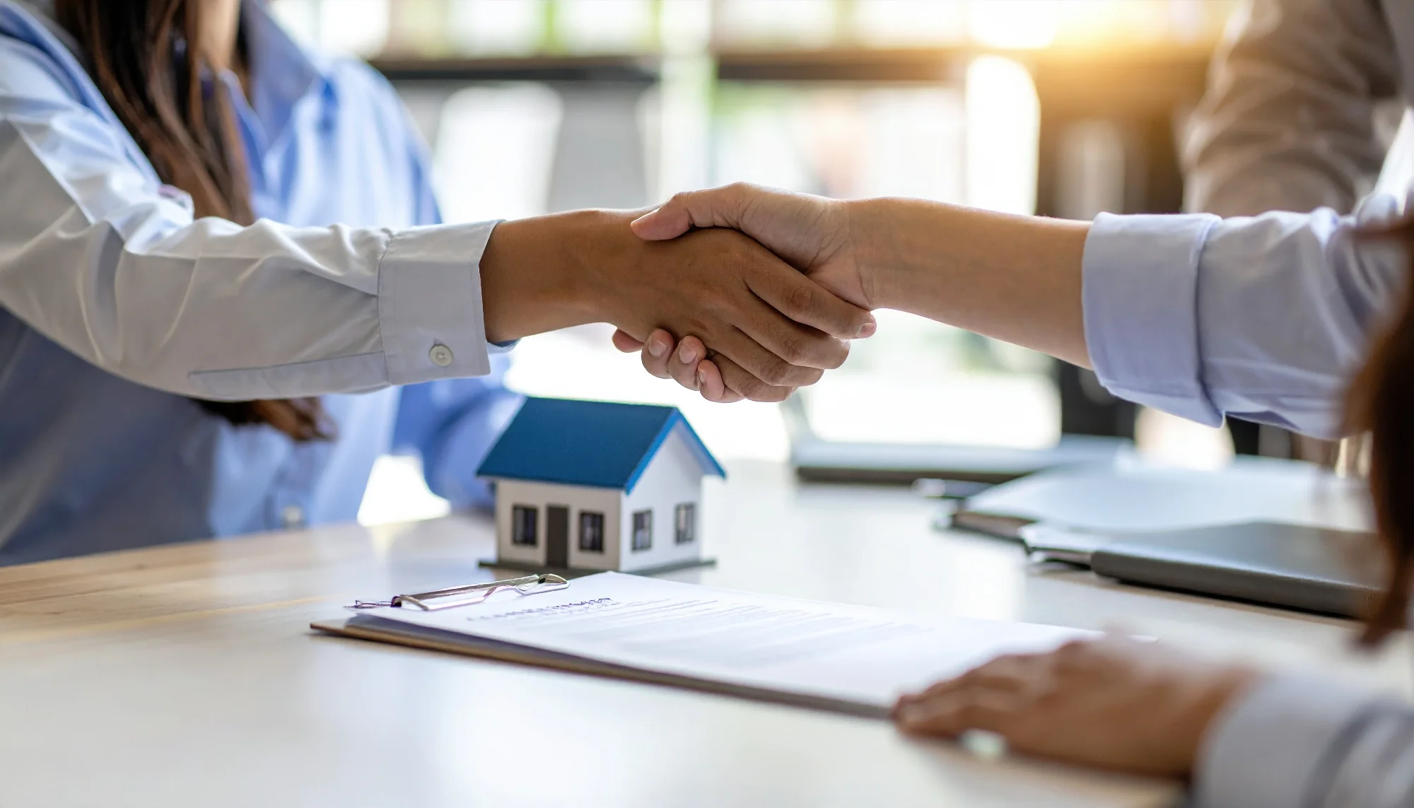 business meeting is taking place featuring handshake